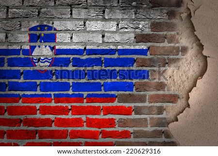 Dark brick wall texture with plaster - flag painted on wall - Slovenia