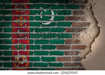 Dark brick wall texture with plaster - flag painted on wall - Turkmenistan