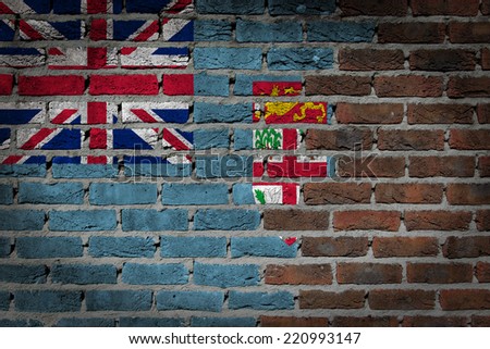 Very old dark red brick wall texture with flag - Fiji