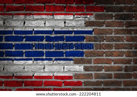 Very old dark red brick wall texture with flag - Thailand