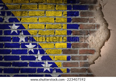 Dark brick wall texture with plaster - flag painted on wall - Bosnia and Herzegovina