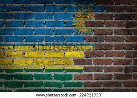 Very old dark red brick wall texture with flag - Rwanda