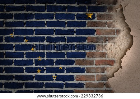 Dark brick wall texture with plaster - flag painted on wall - Alaska