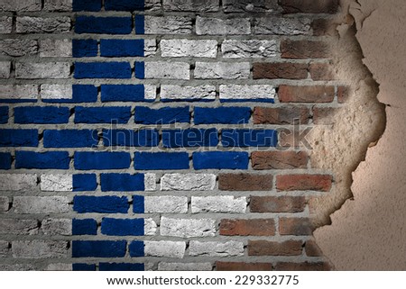 Dark brick wall texture with plaster - flag painted on wall - Finland