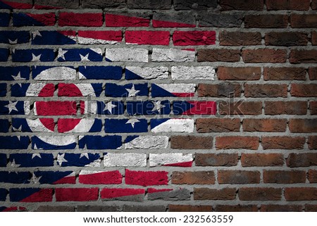 Very old dark red brick wall texture with flag - Ohio