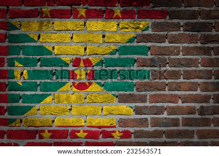 Very old dark red brick wall texture with flag - Grenada