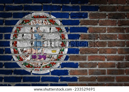 Very old dark red brick wall texture with flag - Virginia