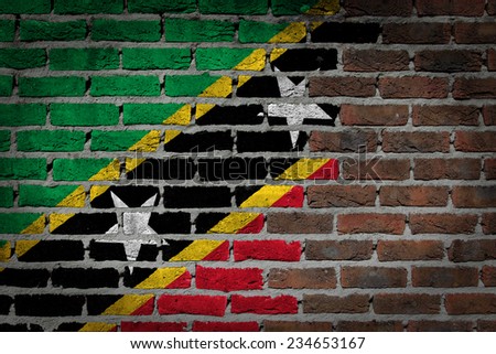 Very old dark red brick wall texture with flag - Saint Kitts and Nevis