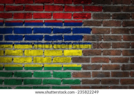 Very old dark red brick wall texture with flag - Mauritius
