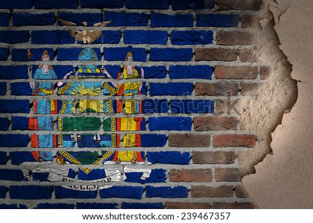 Dark brick wall texture with plaster - flag painted on wall - New York