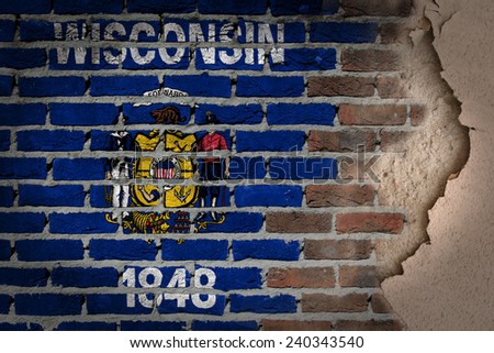 Dark brick wall texture with plaster - flag painted on wall - Wisconsin