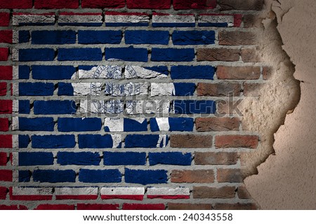 Dark brick wall texture with plaster - flag painted on wall - Wyoming