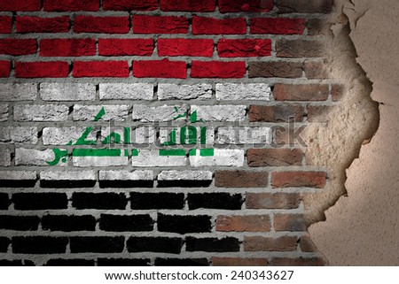 Dark brick wall texture with plaster - flag painted on wall - Iraq