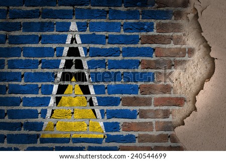 Dark brick wall texture with plaster - flag painted on wall - Saint Lucia