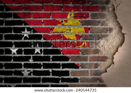 Dark brick wall texture with plaster - flag painted on wall - Papua New Guinea