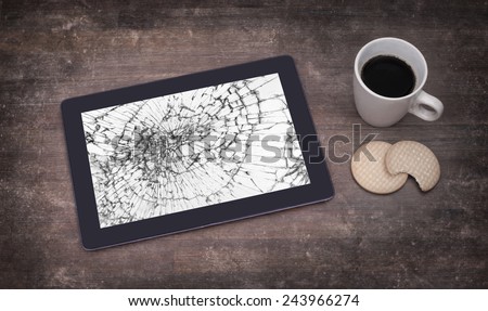 Tablet computer with broken glass, screen destroyed