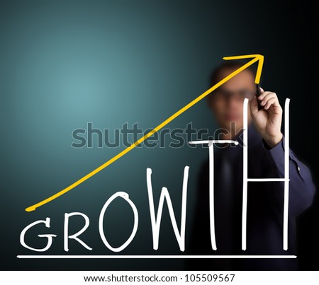 business man writing growth concept
