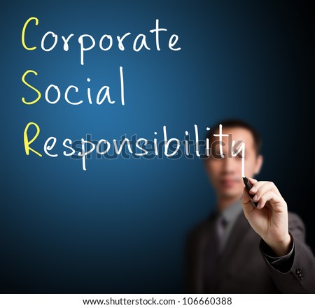 business man writing corporate social responsibility ( CSR ) concept