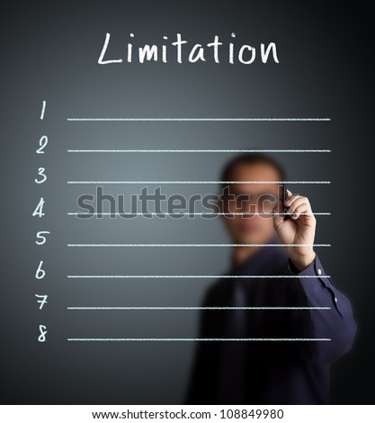 business man writing blank limitation list