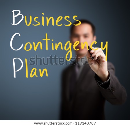 business man writing business contingency plan