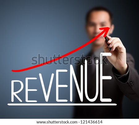 business man writing revenue growth graph