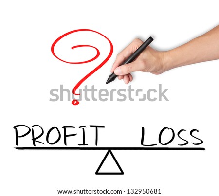 business hand writing profit and loss compare on balance bar