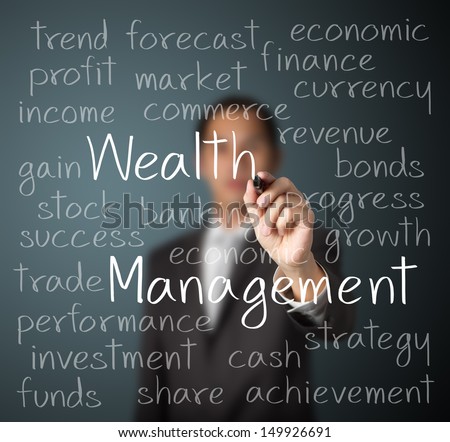 business man writing wealth management concept