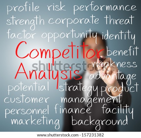 business man writing competitor analysis concept