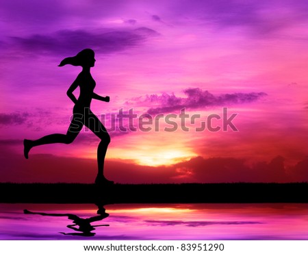healthy woman running at sunrise silhouetted