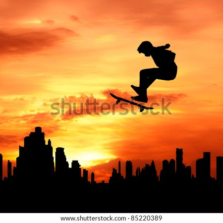 young man skateboarder jumping over the city during sunset silhouetted, extreme sport