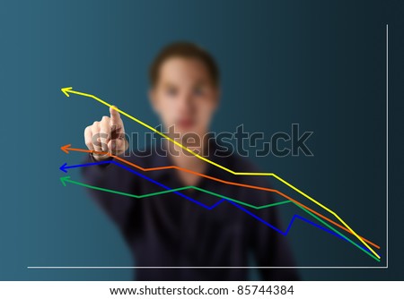 male hand pointing at  highest upward trend graph