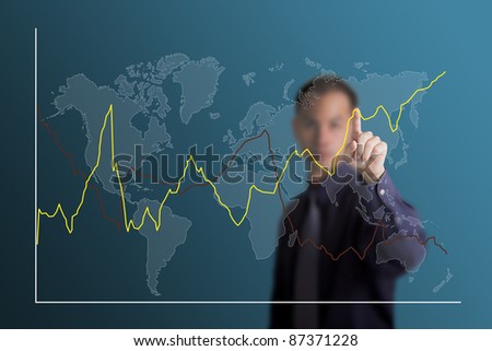 business man selecting to point at fluctuate upward trend graph on world map