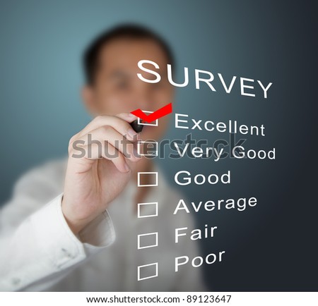 business man checking  excellent on survey form