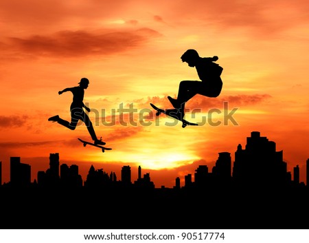 two teenager skateboarder jumping over the city during sunset silhouetted, extreme sport