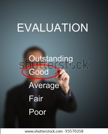 business man write red mark at good choice on evaluation survey form