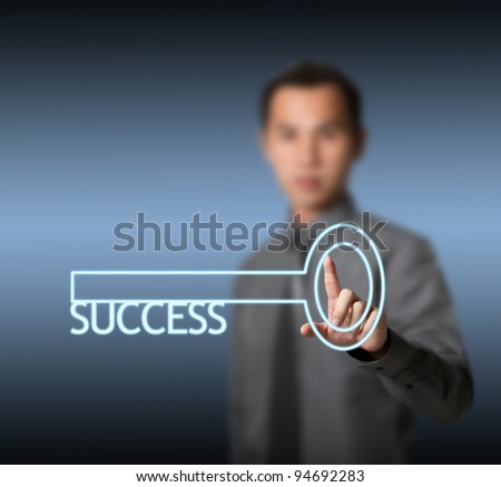 business man holding success key