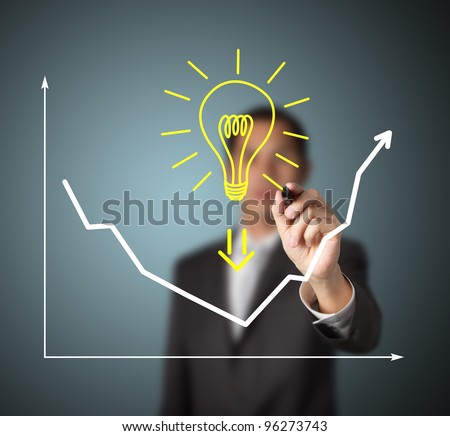 businessman drawing graph to show that big idea can change business trend from downward to upward