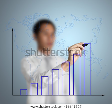 businessman drawing upward trend bar chart with world map