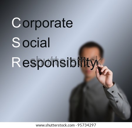business man writing CSR concept ( corporate social responsibility ) on white board