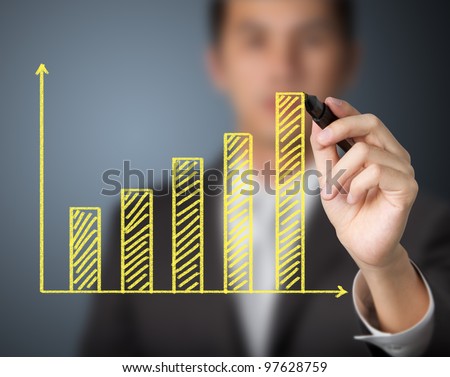 businessman drawing upward trend bar chart
