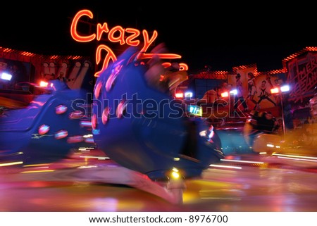 Speedy attraction in amusement park, motion blur