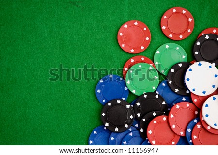Poker chips on green background. Room for text.