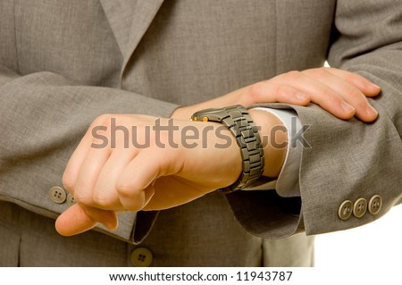 Businessman checking the time on his watch.