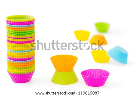 Pink, orange, green, blue and yellow silicone baking cups for muffins or cupcakes