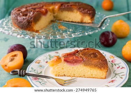 Upside-down plum cake, slice with fork