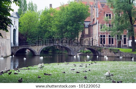 Image of a canal with a beautiful reflection in the love\'s lake of town Bruges.