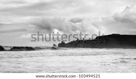 Black and white image of stormy day on the sea. There are rocky island in Bretagne, Finistere, France.