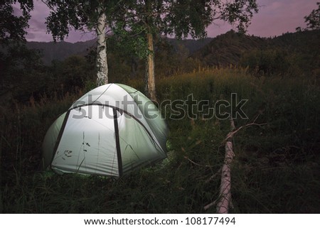 Image of the tent camp with night lighting flashlight in mountains of Almaty, Kazakhstan