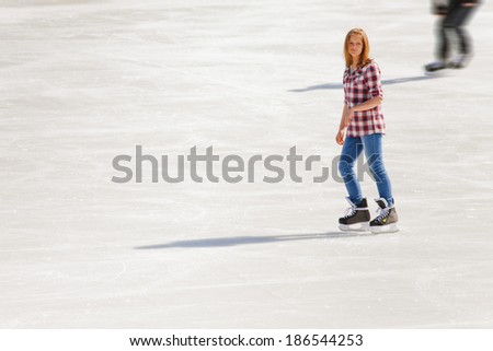 Young girl at the ice rink outdoor at Medeo, Almaty, Kazakhstan