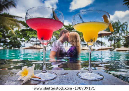 first date lovers at water in pool, near hotel